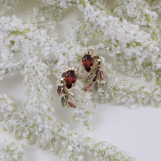 10K yellow gold pear garnet and leaf branch earrings by Mt. Rushmore Black Hills Gold