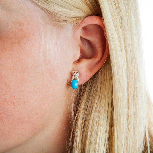 Sterling silver oval turquoise and diamond accent earrings by Mt. Rushmore Black Hills Gold