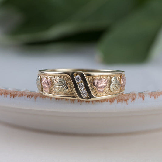 10K yellow gold men's 3-stone diamond accent channel set textured wedding ring by Mt. Rushmore Black Hills Gold