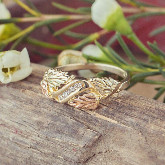 10K yellow gold 1/8 ct. tw. round diamond channel set grapevine and leaf anniversary ring by Mt. Rushmore Black Hills Gold