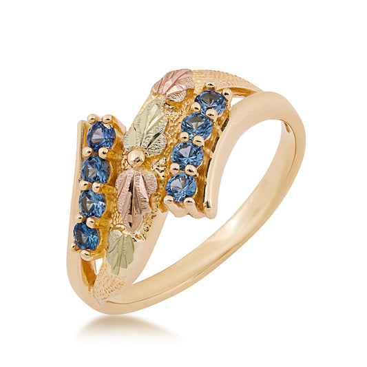 10K yellow gold round Yogo sapphire bypass ring with Black Hills Gold detailing