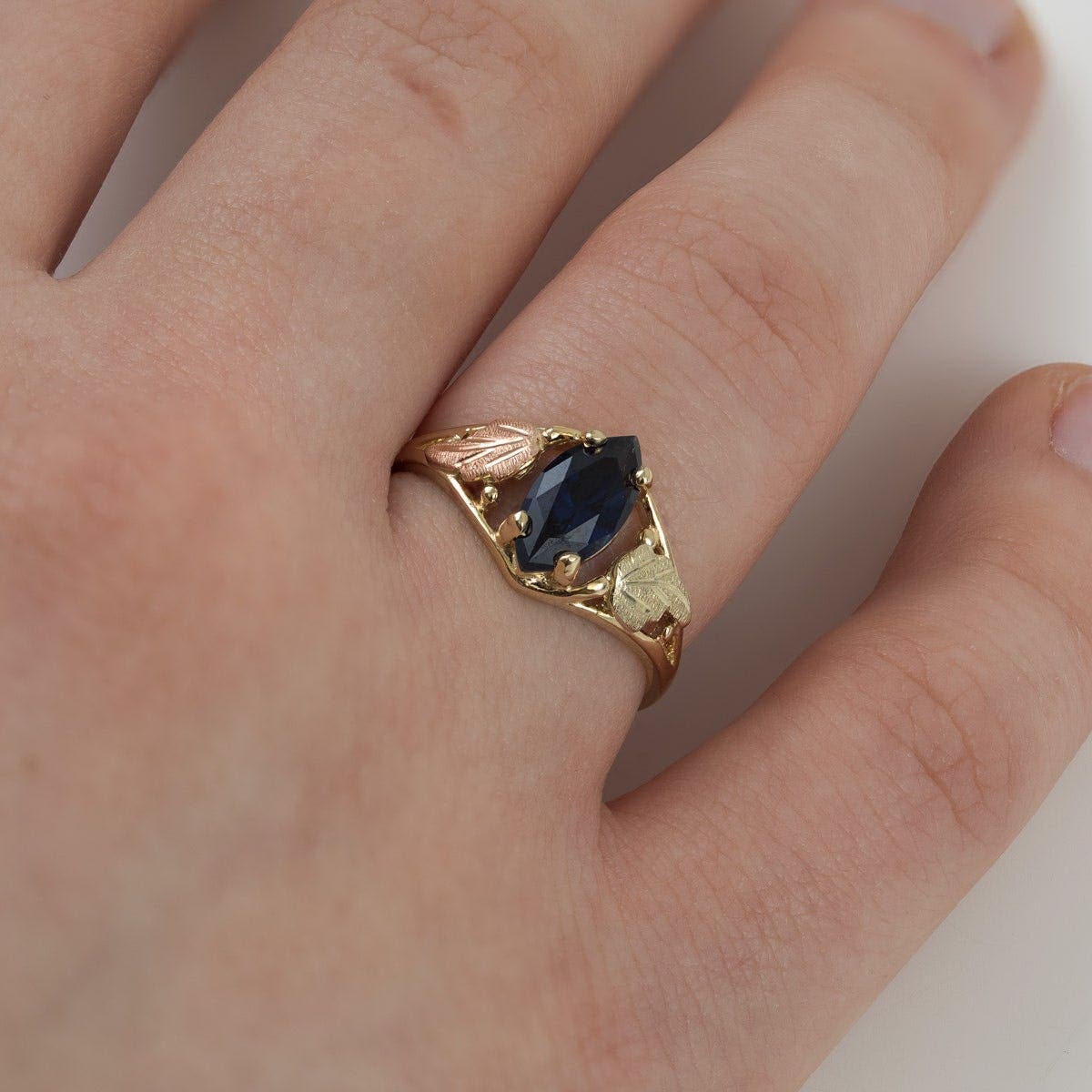 10K yellow gold created marquise sapphire open double leaf ring by Mt. Rushmore Black Hills Gold, close-up view