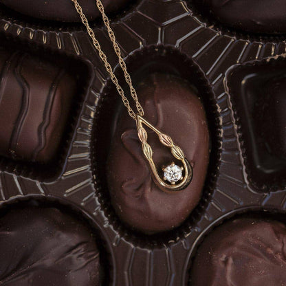 10K yellow gold noventa and Black Hills Gold 1/3 ct. tw. round diamond teardrop pendant