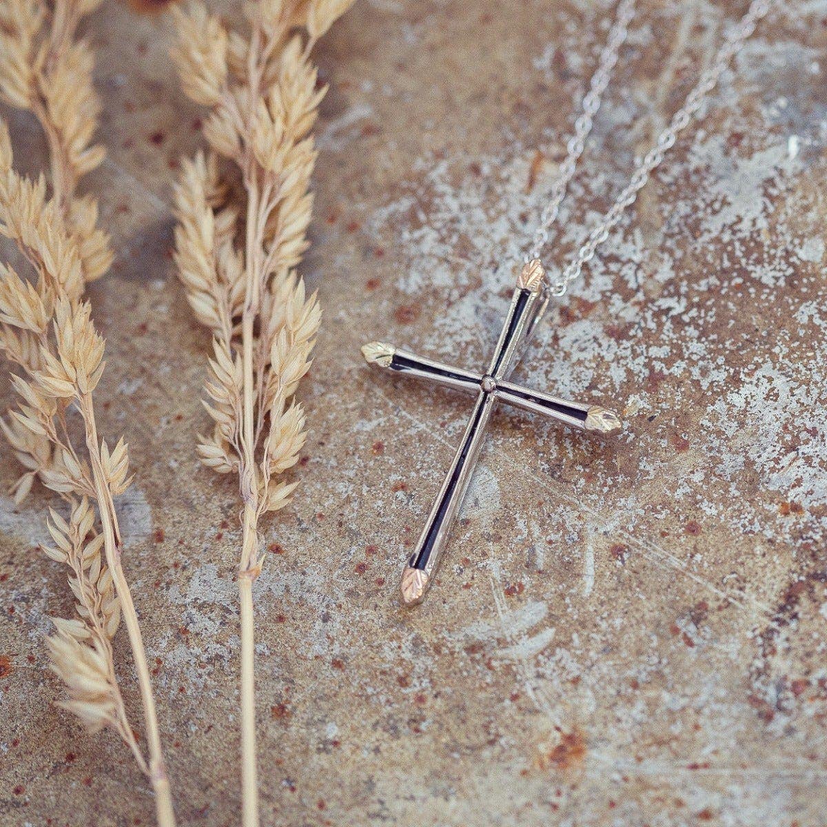 Sterling silver antiqued cross and leaf pendant by Mt. Rushmore Black Hills Gold