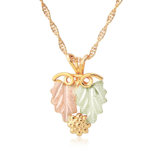 10K yellow gold double leaf and curled grapevine pendant by Landstrom's Black Hills Gold