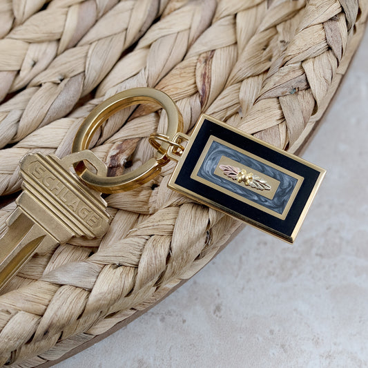 Double leaf black and gray enamel keychain by Landstrom's Black Hills Gold, styled view