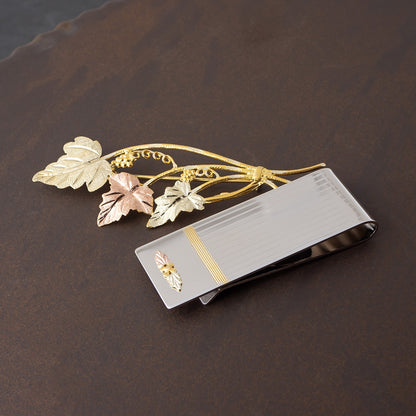 Double leaf and grape lined money clip by Landstrom's Black Hills Gold, styled view