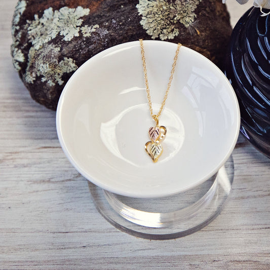 10K yellow gold double leaf half heart pendant by Landstrom's Black Hills Gold, styled view