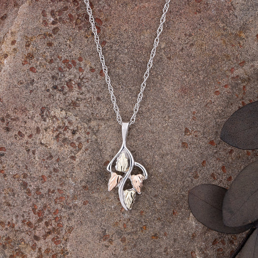 Sterling silver four leaf pendant by Landstrom's Black Hills Gold, styled view