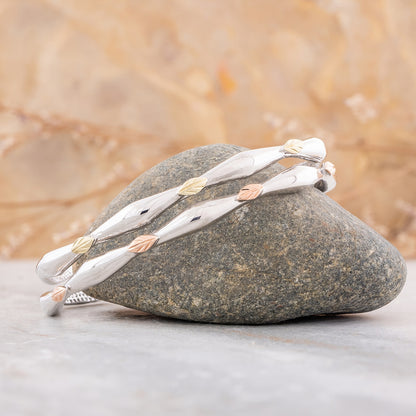 Sterling silver double vine and leaf cuff bracelet by Landstrom's Black Hills Gold, styled view