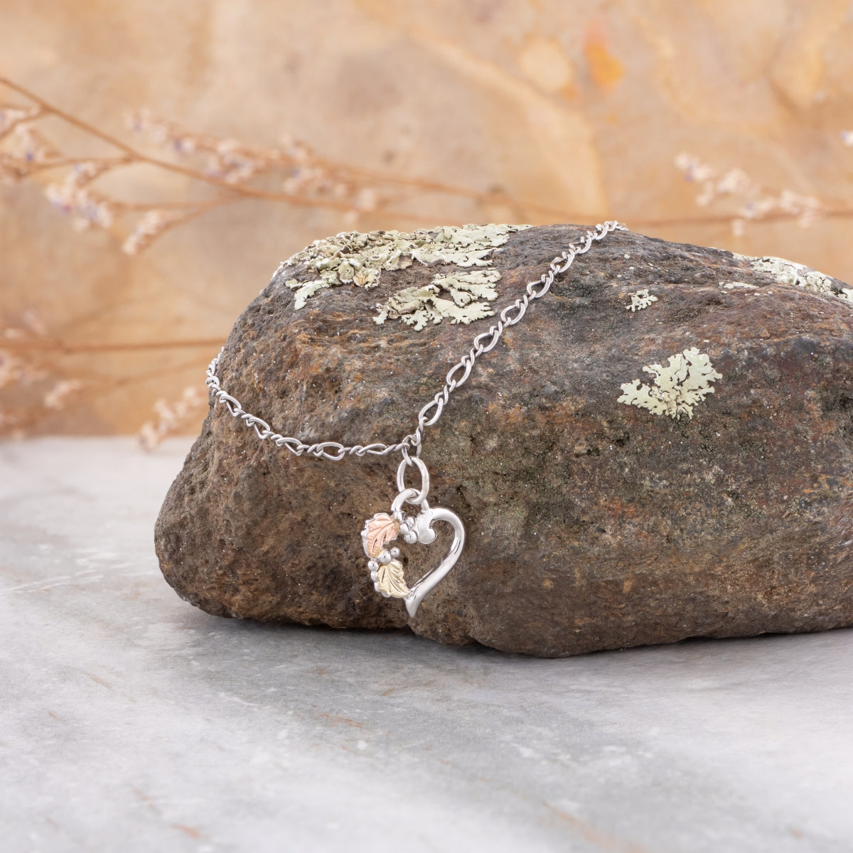 Sterling silver 9" heart link ankle bracelet by Landstrom's Black Hills Gold, styled view
