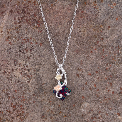 Sterling silver created mosaic opal pendant by Landstrom's Black Hills Gold, styled view