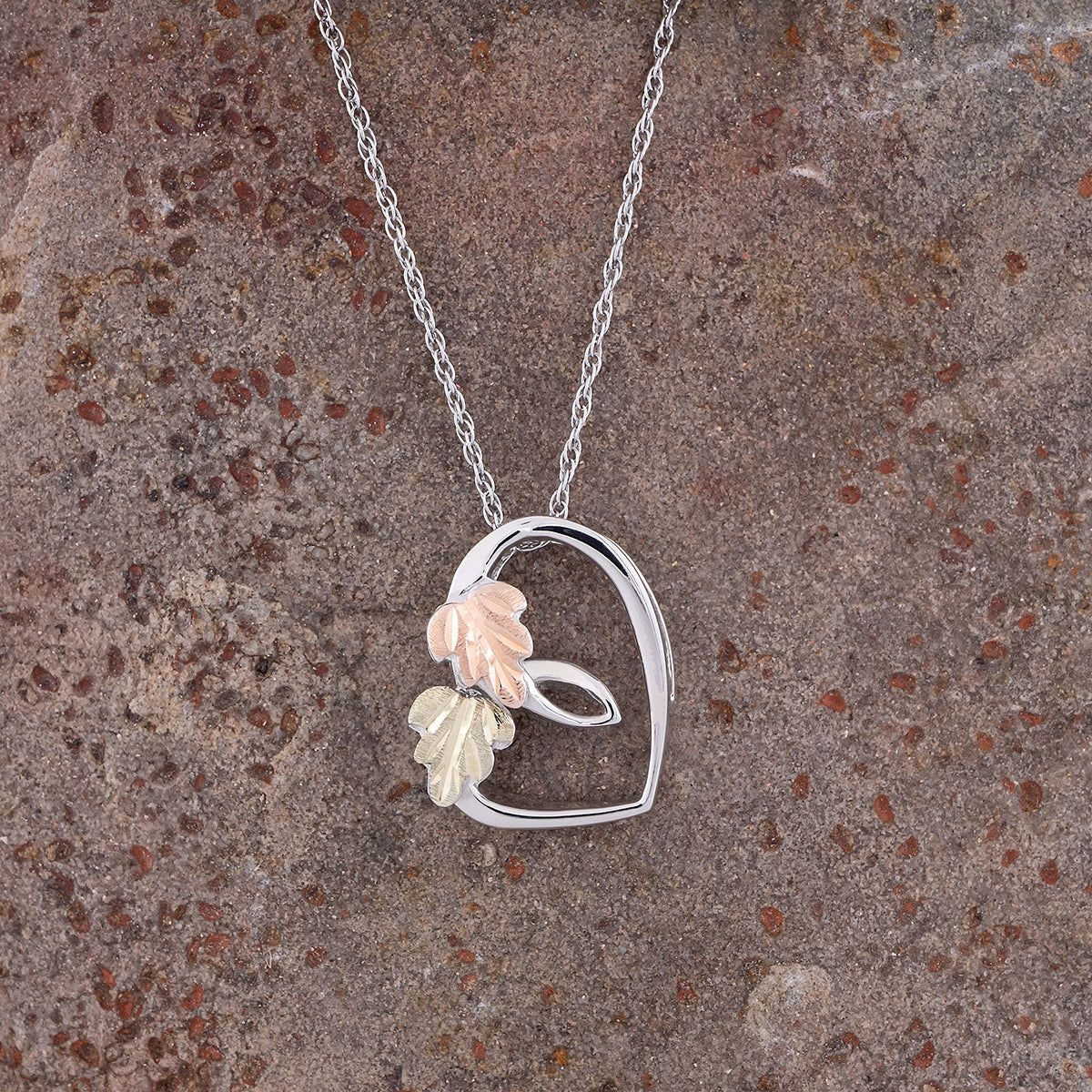 Sterling silver sliding heart pendant by Landstrom's Black Hills Gold, styled view