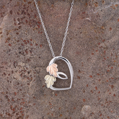 Sterling silver sliding heart pendant by Landstrom's Black Hills Gold, styled view