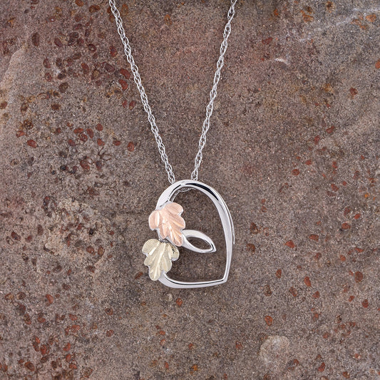 Sterling silver sliding heart pendant by Landstrom's Black Hills Gold, styled view