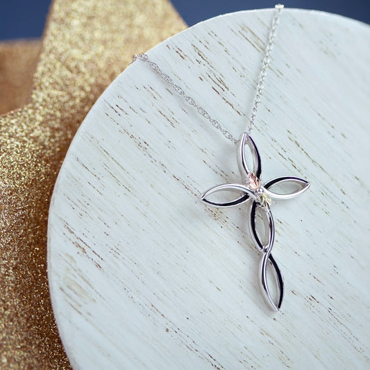 Sterling silver antiqued twist cross pendant by Landstrom's Black Hills Gold, styled view