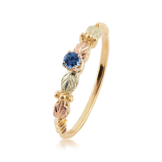 10K yellow gold round Yogo sapphire and leaf ring with Black Hills Gold detailing