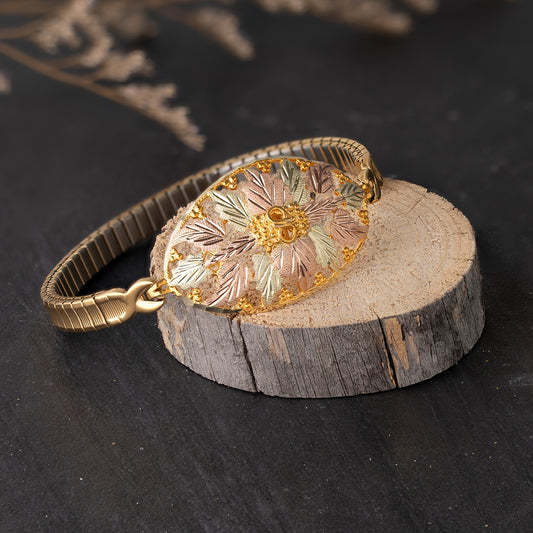 10K yellow gold oval leaf and grape expansion bracelet by Landstrom's Black Hills Gold, styled view