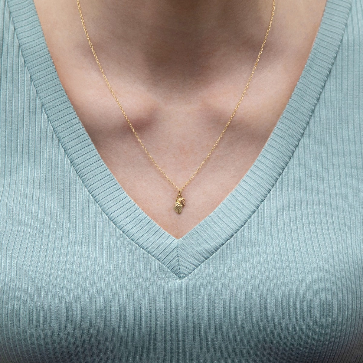 10K yellow gold double leaf and grape pendant by Mt. Rushmore Black Hills Gold, shown worn