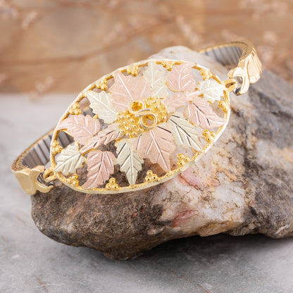 10K yellow gold oval expansion bracelet by Mt. Rushmore Black Hills Gold, styled view