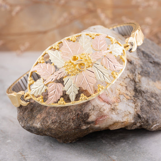 10K yellow gold oval expansion bracelet by Mt. Rushmore Black Hills Gold, styled view