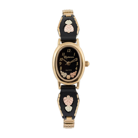 Women's quartz gold-tone stainless steel watch featuring black oval dial and powder coated band by Mt. Rushmore Black Hills Gold