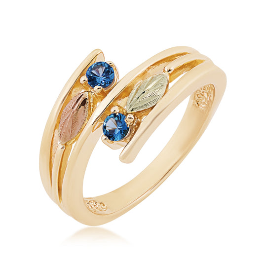 10K yellow gold round 2-stone Yogo sapphire and leaf bypass ring with Black Hills Gold detailing