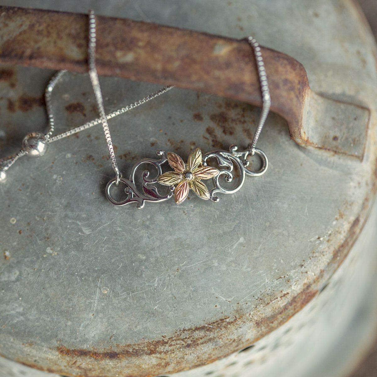 Sterling silver leaf flower and vine bolo bracelet by Mt. Rushmore Black Hills Gold