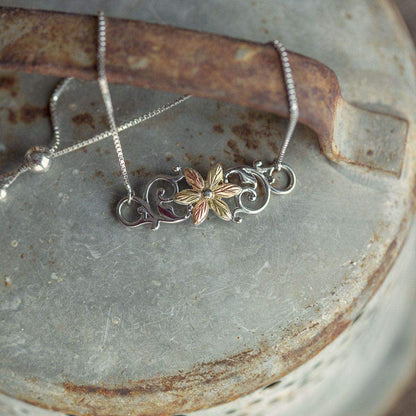Sterling silver leaf flower and vine bolo bracelet by Mt. Rushmore Black Hills Gold