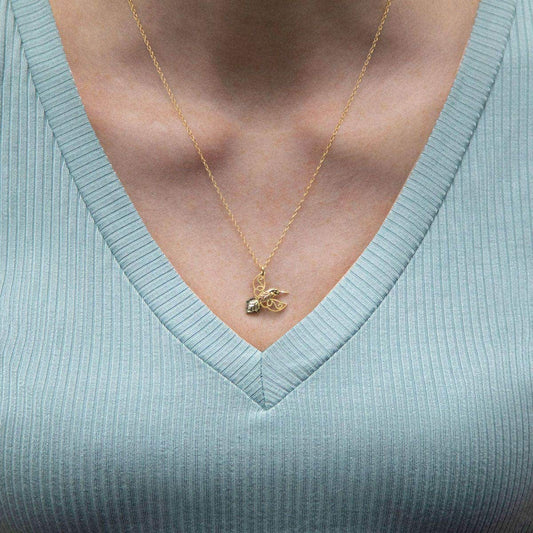 10K yellow gold milgrain hummingbird pendant by Mt. Rushmore Black Hills Gold, shown worn