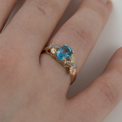 10K yellow gold oval blue topaz and diamond accent ring by Mt. Rushmore Black Hills Gold, side view