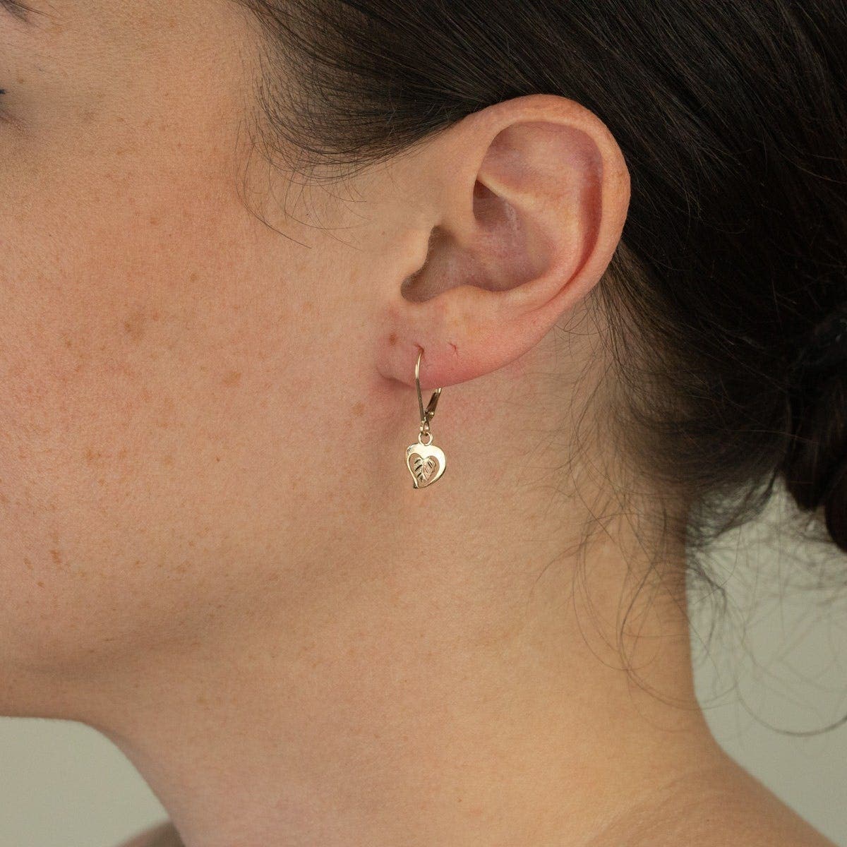 10K yellow gold heart and two-tone leaf dangle earrings by Mt. Rushmore Black Hills Gold