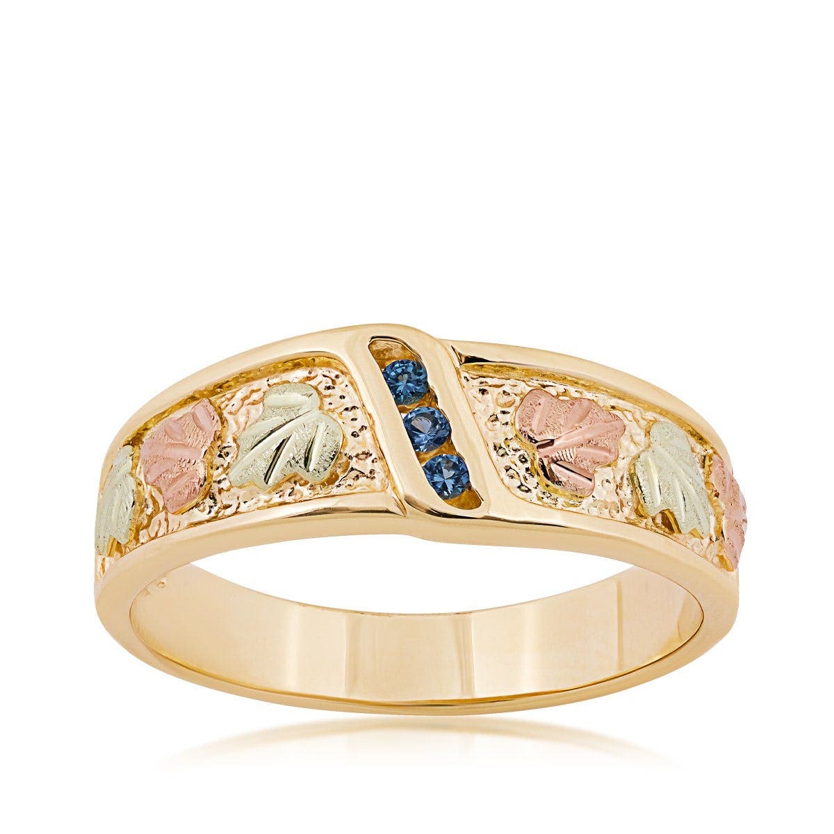10K yellow gold men's round 3-stone Yogo sapphire channel set wedding ring with Black Hills Gold detailing