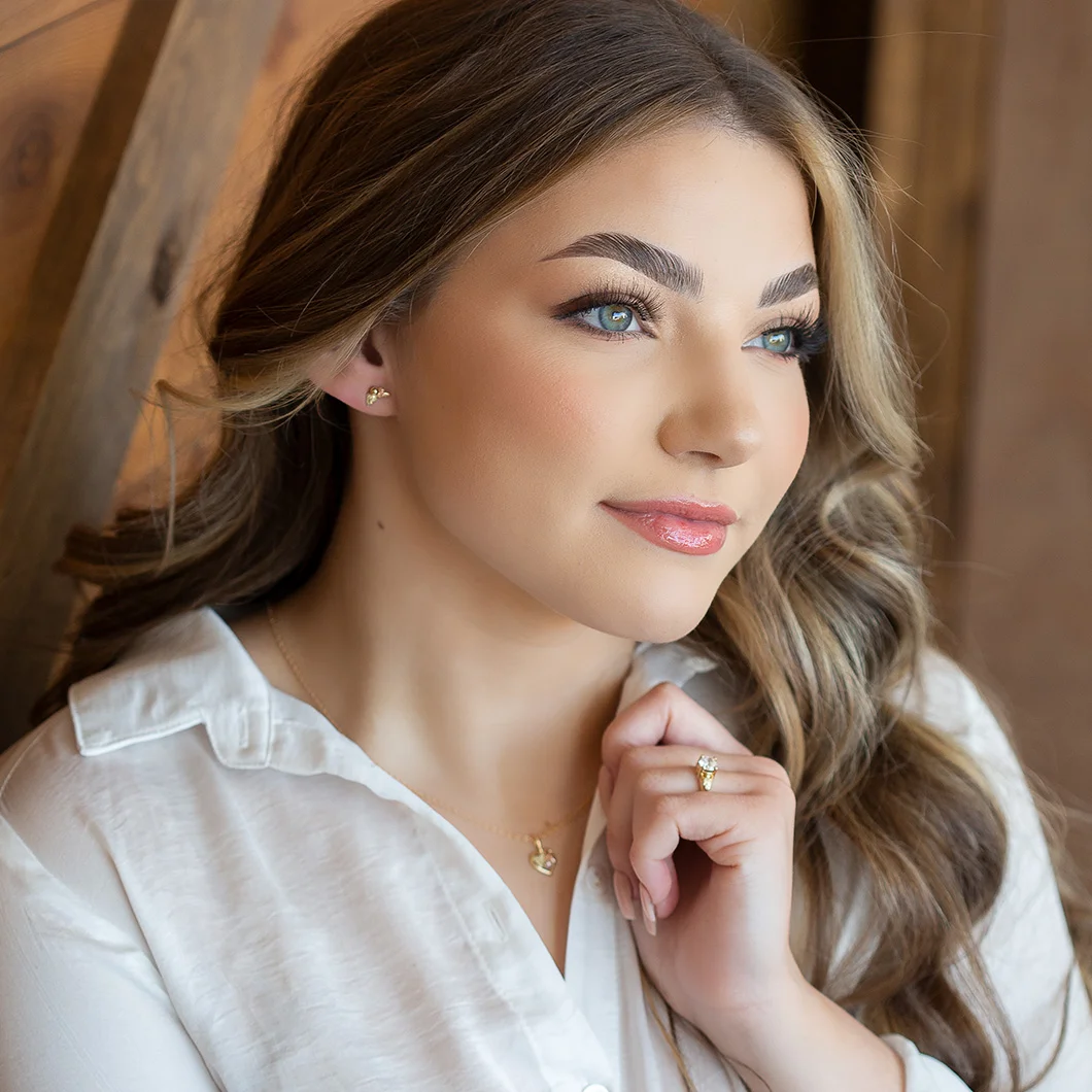 Woman weating Black Hills Gold jewelry