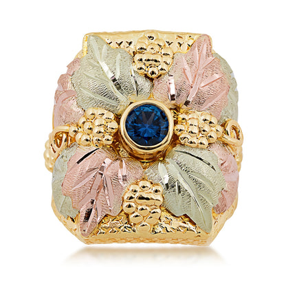 10K yellow gold men's round Yogo sapphire bezel set grape cluster and leaf ring with Black Hills Gold detailing