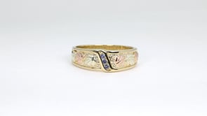 10K yellow gold men's round 3-stone Yogo sapphire channel set wedding ring with Black Hills Gold detailing, product video